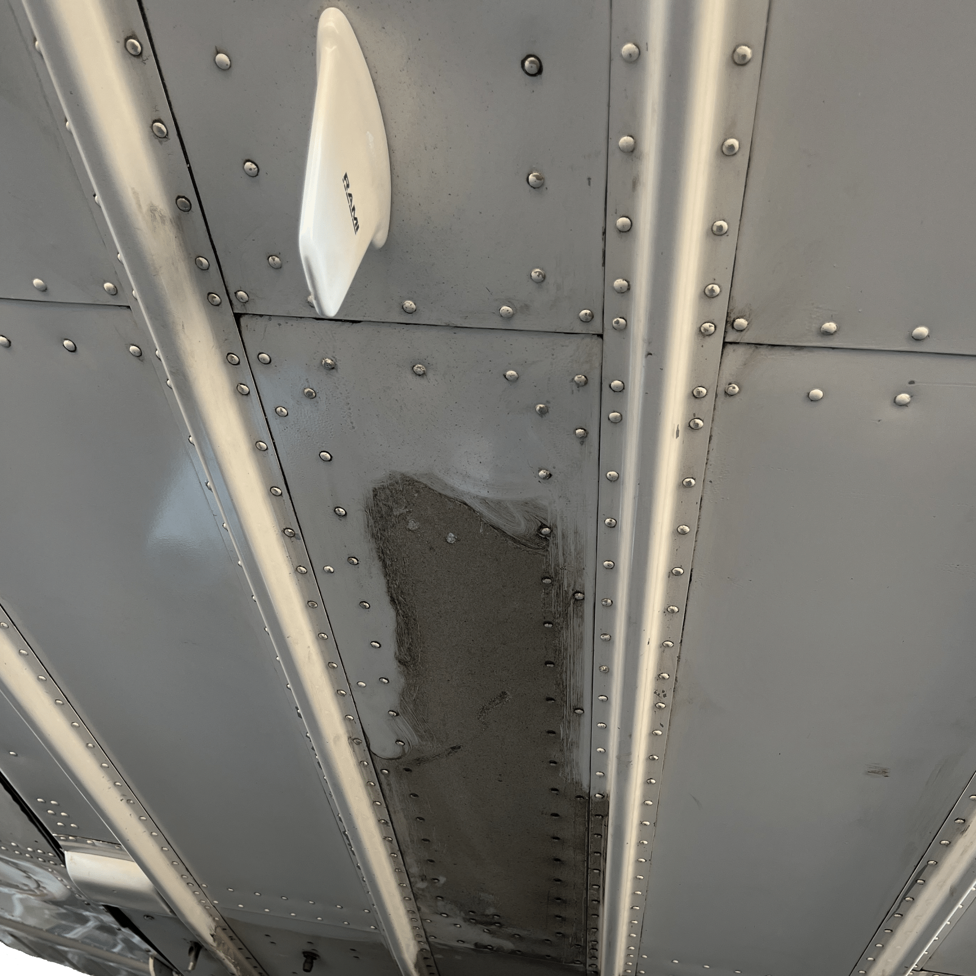 Plane Exhaust Soot and Oil Residue