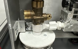 Nozzle Applying Thread Sealant to valve