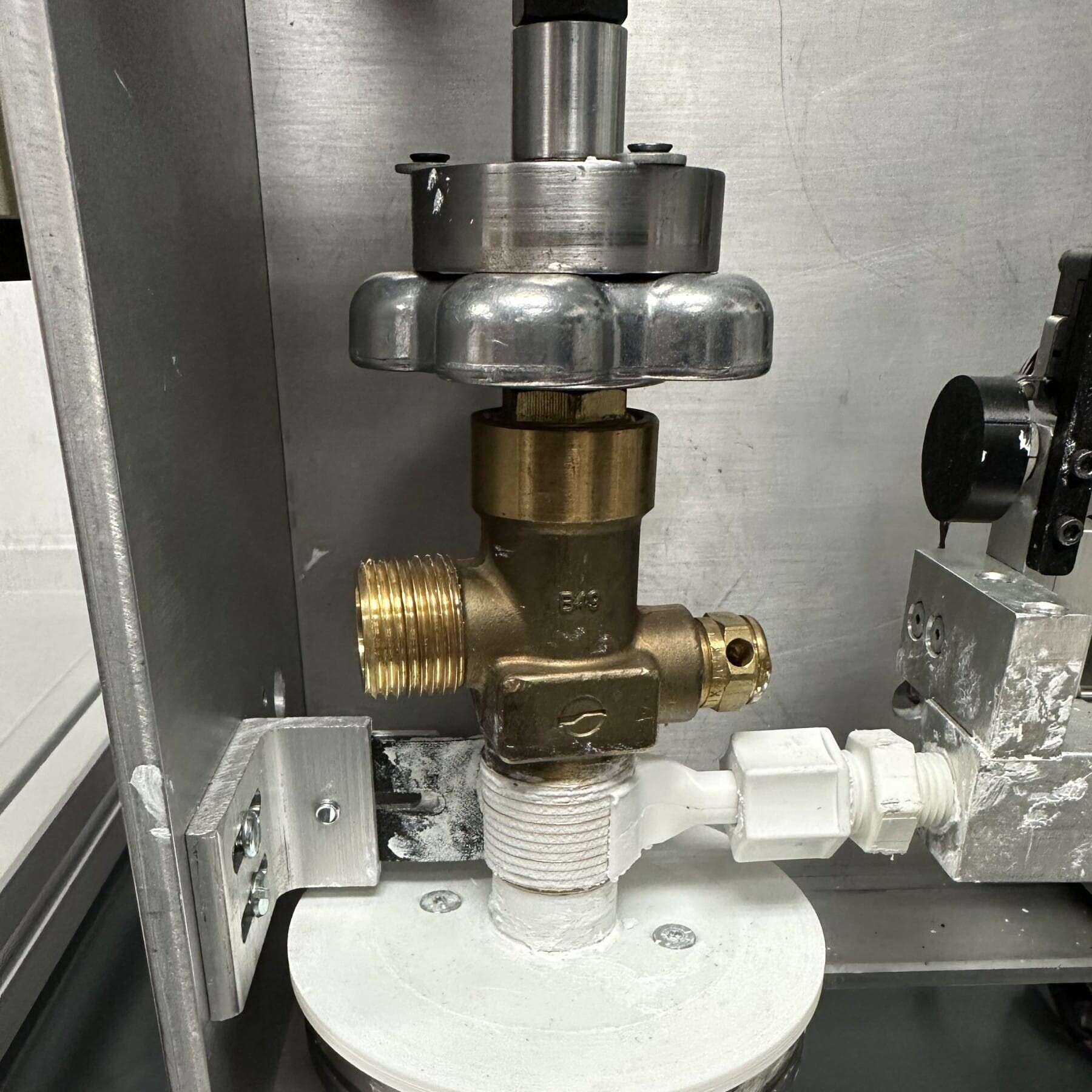 Nozzle Applying Thread Sealant to valve